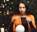 Portrait of fortune-teller in a dark room